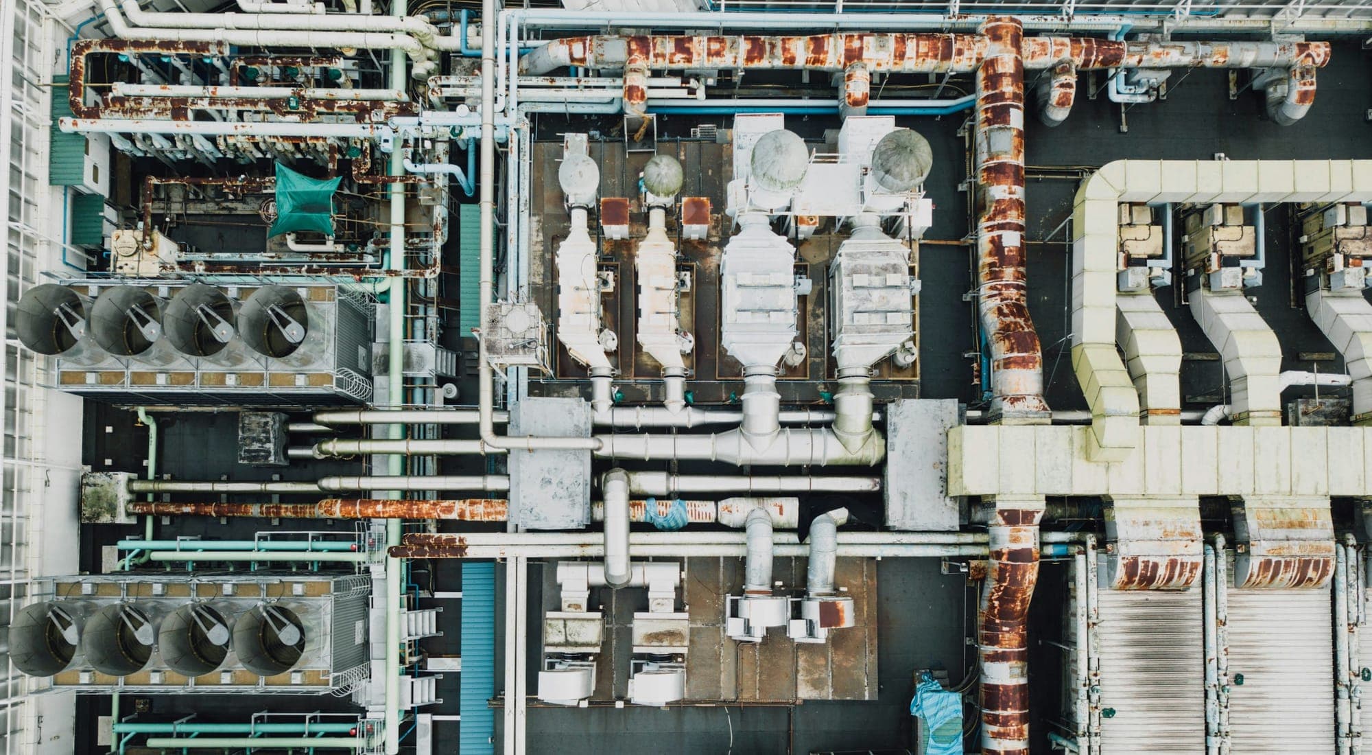 An industrial plant seen directly from above, pipework and ducts interlocking