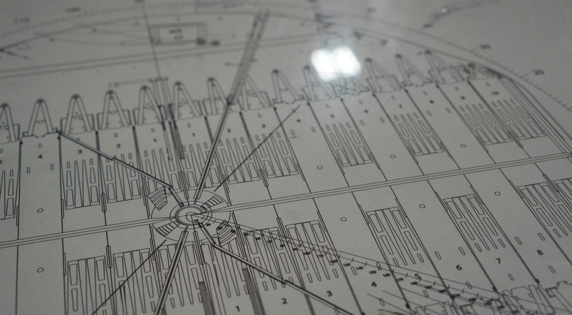 A large-format technical drawing under raking light