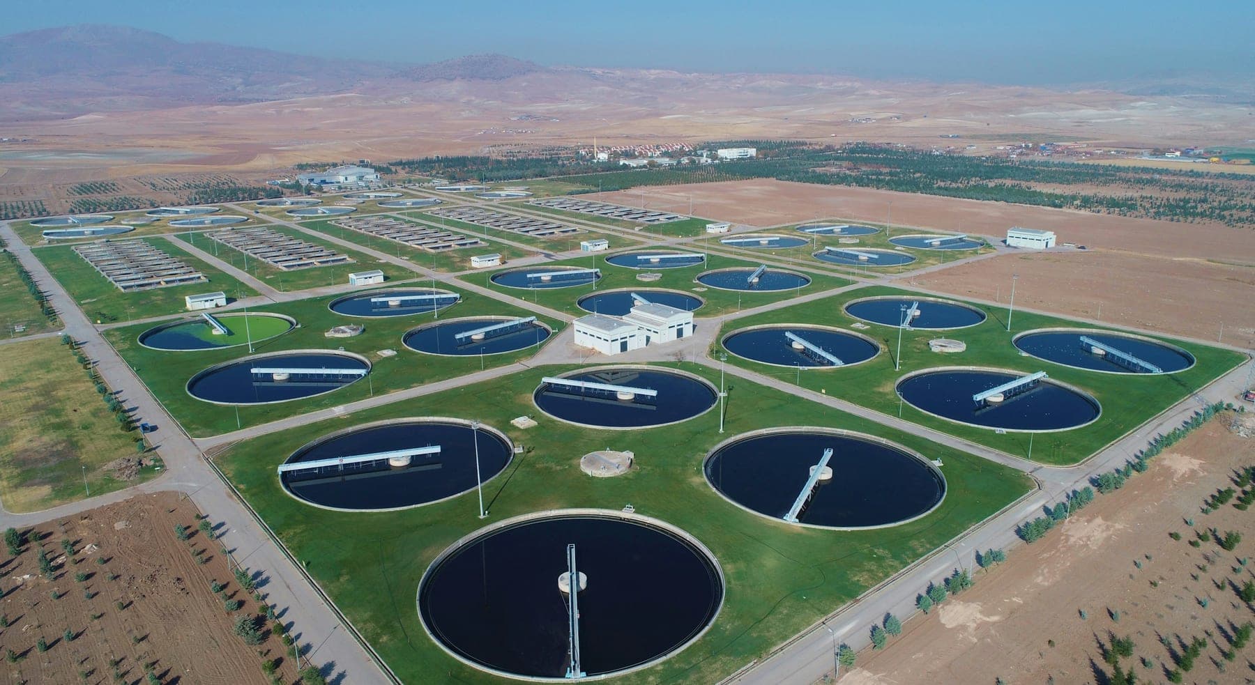 Aerial view of a water treatment works, circular clarifiers laid out in a grid